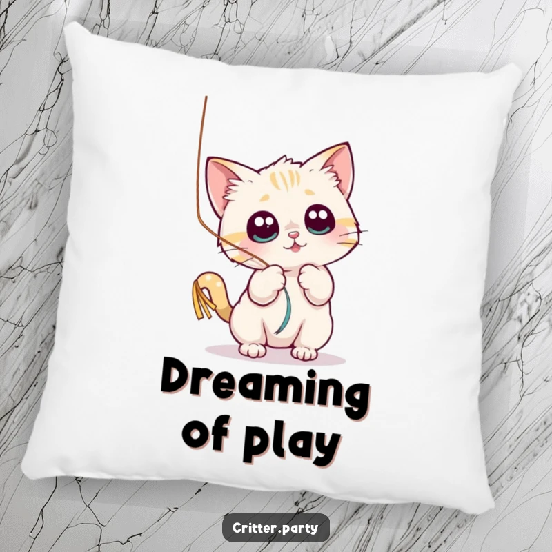 Funny pillow featuring a small cat character playfully batting at a shiny, dangling streamer with wide eyes, for soft amusement.