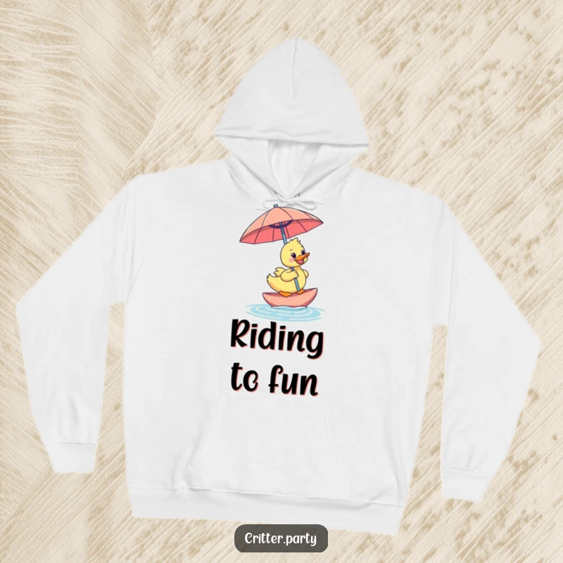Funny duckling hoodie featuring a happy duckling riding an oversized cocktail umbrella, offering cozy warmth and tropical humor.
