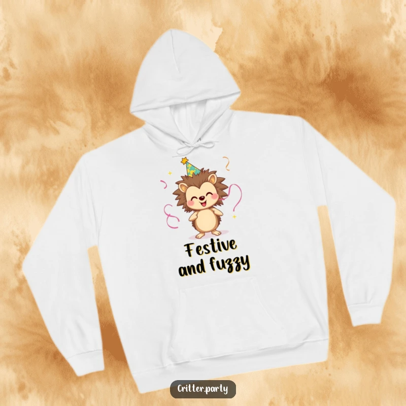 Funny hoodie showing a smiling hedgehog in a party hat, juggling streamers with enthusiasm, perfect for festive occasions and spreading joy.