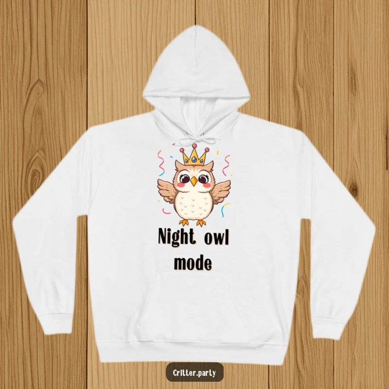 Thrilled owl wearing a festive crown, with streamers, a cozy and humorous hoodie for festive warmth.