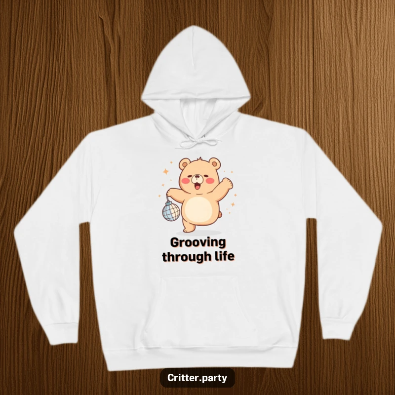Soft funny chubby bear dancing ecstatically with a miniature disco ball, designed on a cozy hoodie for ultimate party comfort.