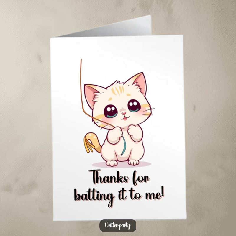 Funny Free Printable Thank You Card: A small cat playfully batting a shiny streamer with wide eyes, a charming downloadable.