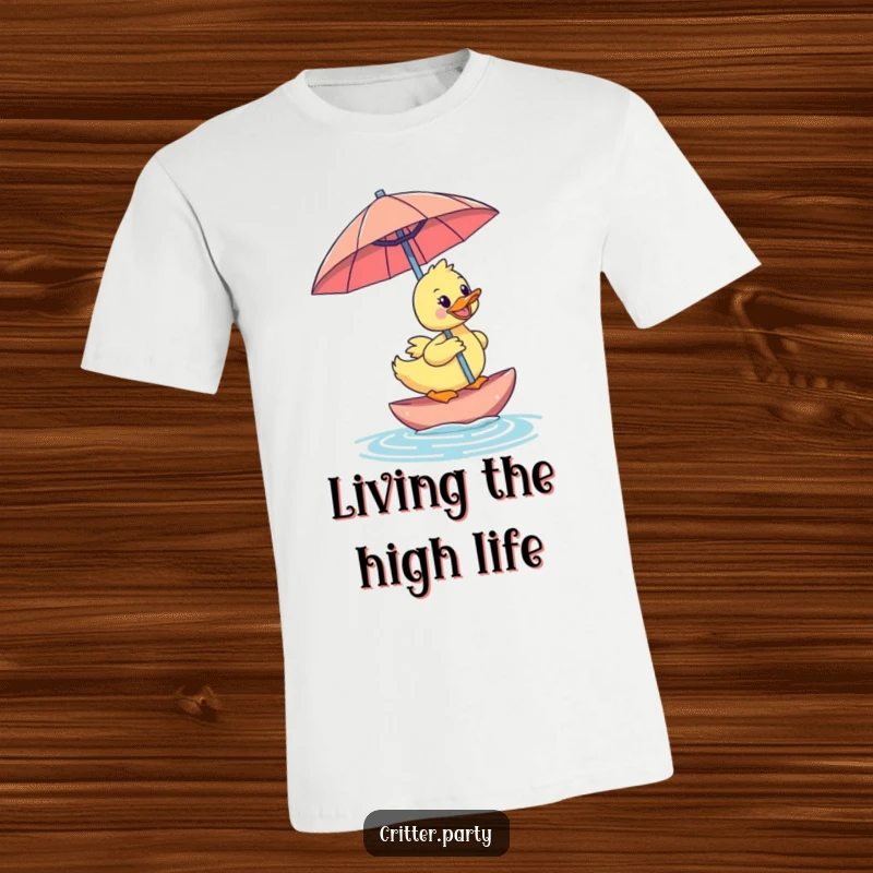 Funny happy duckling styled as a surfer, riding a floating, oversized cocktail umbrella on a t-shirt for a humorous and fun look.