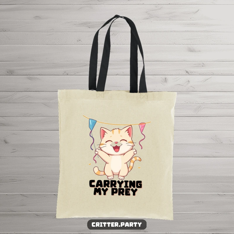 Funny cat tote bag with a playful cat batting at a dangling party streamer, perfect for carrying essentials with a touch of humor.